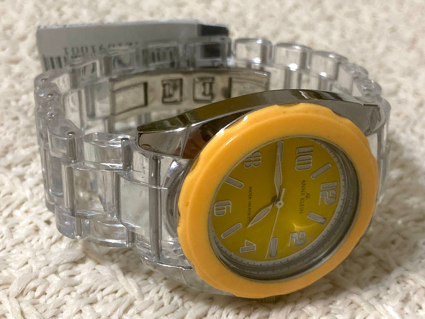 AK Anne Klein Transparent Bracelet Yellow Dial Women's Watch
